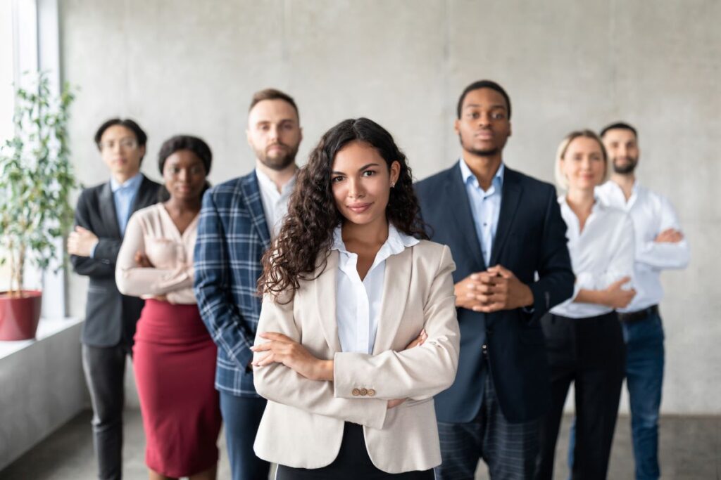 diverse group of female and male leaders looking at camera