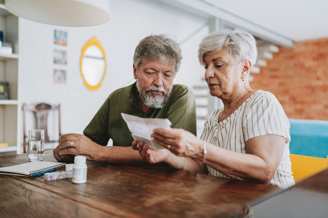 Senior-couple-medicating-at-home-with-medical-prescription-web